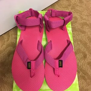 Teva sandals in a pink/raspberry color